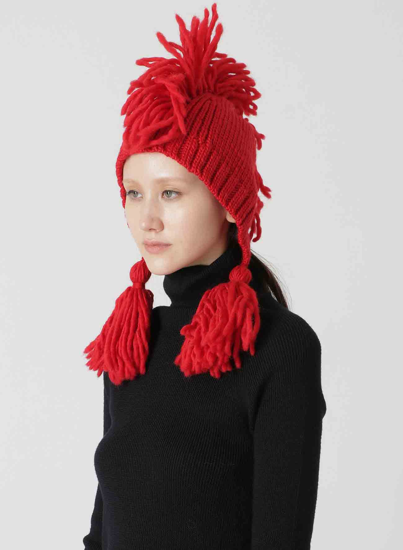 KNITTED WOOL JERSEY HAT WITH TASSELS AND SPIKES