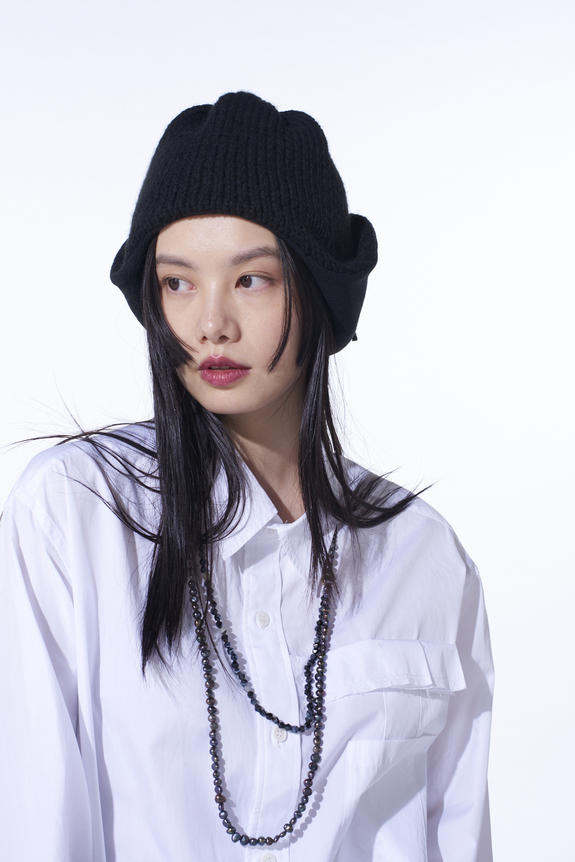 KNIT BEANIE WITH FRINGED EARPIECES